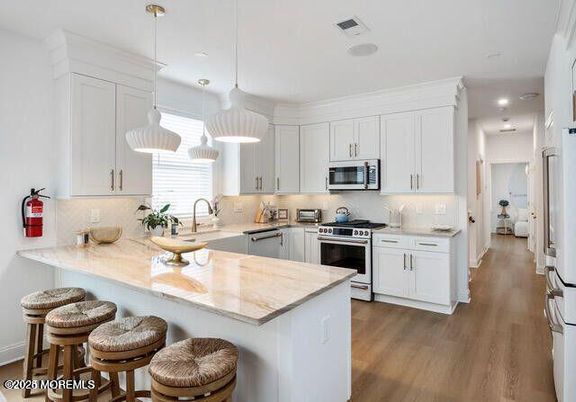 Interior, Kitchen, Pendant Lights, Recessed Lighting, Stainless Steel Appliances, Wood Texture Flooring
