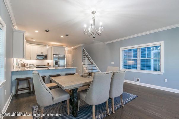 Chandelier, Dining room, Interior, Kitchen, Pendant Lights, Recessed Lighting, Stainless Steel Appliances, Wood Texture Flooring