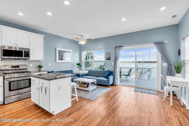 Dining room, Interior, Kitchen, Living room, Recessed Lighting, Stainless Steel Appliances, Wood Texture Flooring