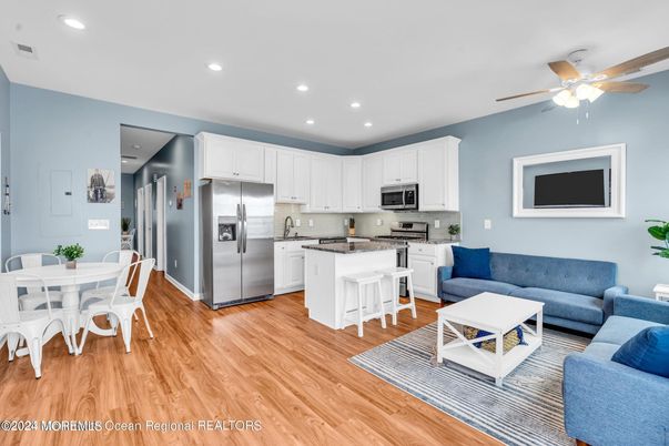 Dining room, Interior, Kitchen, Living room, Recessed Lighting, Stainless Steel Appliances, Wood Texture Flooring