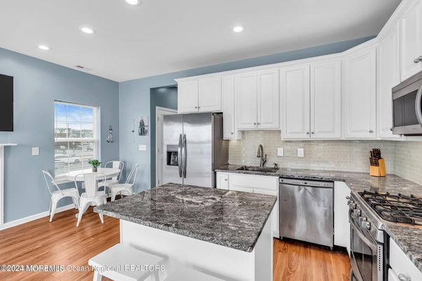 Dining room, Interior, Kitchen, Recessed Lighting, Stainless Steel Appliances, Wood Texture Flooring