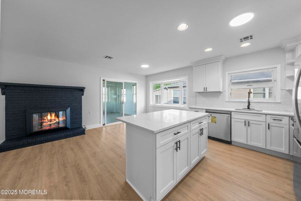 Fireplace, Interior, Kitchen, Recessed Lighting, Wood Texture Flooring