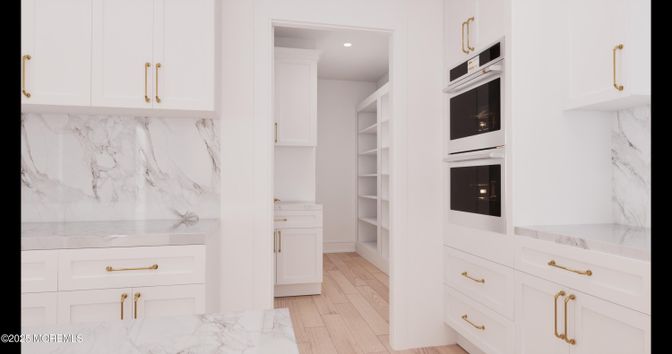 Interior, Kitchen, Marble, Marble Walls, Recessed Lighting, Stainless Steel Appliances, Wood Texture Flooring