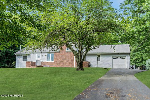Attached, Backyard, Exterior, Facade, Brick Facade, Cape Cod