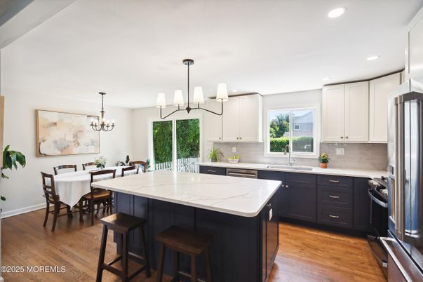 Chandelier, Dining room, Interior, Kitchen, Recessed Lighting, Stainless Steel Appliances, Wood Texture Flooring