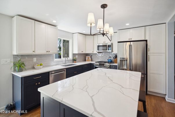 Chandelier, Interior, Kitchen, Pendant Lights, Recessed Lighting, Stainless Steel Appliances, Wood Texture Flooring