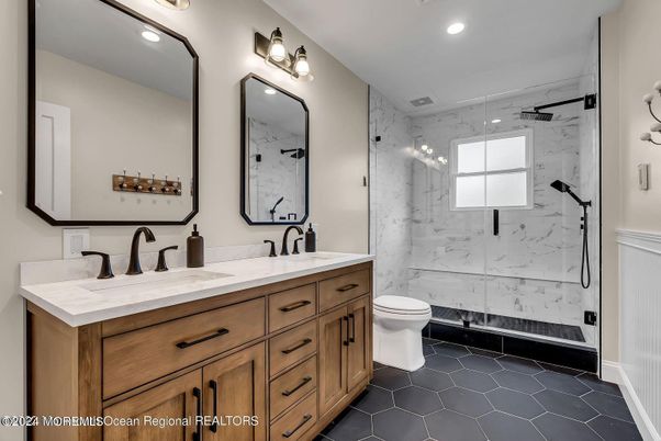 Bathroom, Dual Sink Vanities, Glass Shower, Interior, Marble Walls, Recessed Lighting
