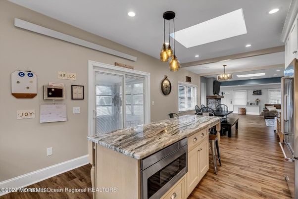 Dining room, Interior, Kitchen, Pendant Lights, Recessed Lighting, Stainless Steel Appliances, Wood Texture Flooring