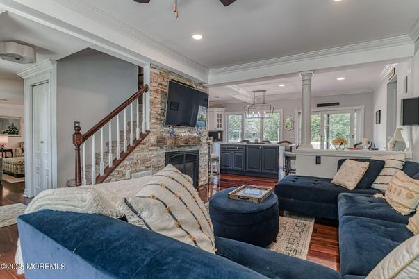 Fireplace, Interior, Living room, Recessed Lighting, Stone Walls, Wood Texture Flooring