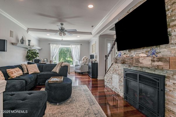 Fireplace, Interior, Living room, Recessed Lighting, Stone Walls, Wood Texture Flooring