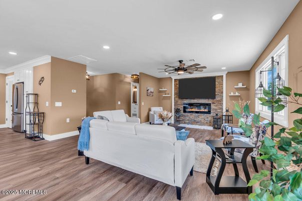 Fireplace, Interior, Kitchen, Living room, Recessed Lighting, Stone Walls, Wood Texture Flooring
