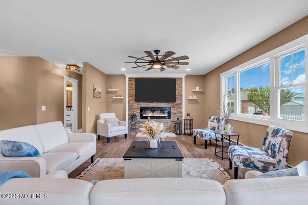Fireplace, Interior, Living room, Recessed Lighting, Stone Walls, Wood Texture Flooring