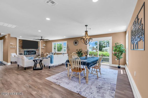 Chandelier, Dining room, Fireplace, Interior, Living room, Recessed Lighting, Stone Walls, Wood Texture Flooring