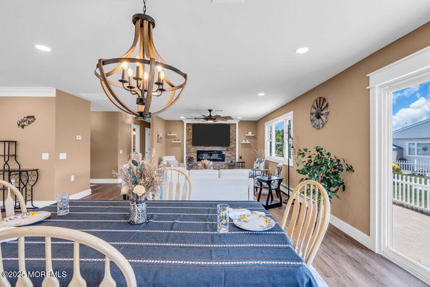 Chandelier, Dining room, Fireplace, Interior, Recessed Lighting, Wood Texture Flooring