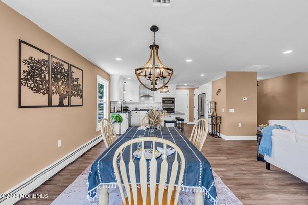 Chandelier, Dining room, Interior, Kitchen, Recessed Lighting, Stainless Steel Appliances, Wood Texture Flooring