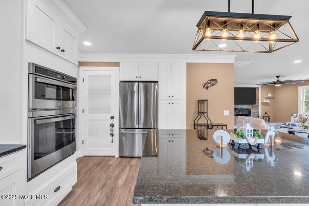 Dining room, Interior, Kitchen, Recessed Lighting, Stainless Steel Appliances, Wood Texture Flooring