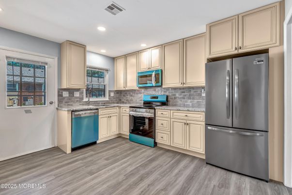 Interior, Kitchen, Recessed Lighting, Stainless Steel Appliances, Wood Texture Flooring