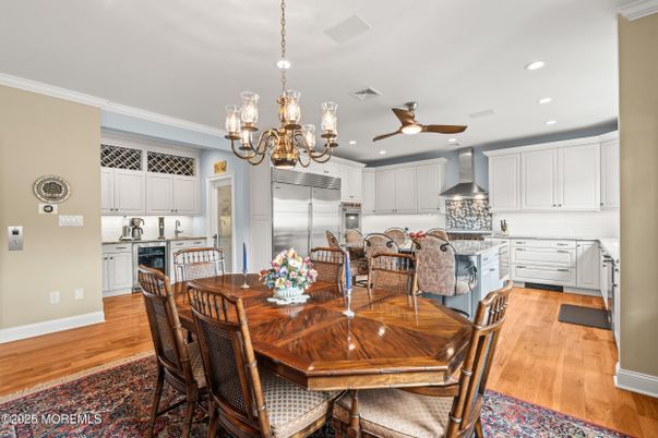 Chandelier, Dining room, Interior, Kitchen, Recessed Lighting, Stainless Steel Appliances, Wood Texture Flooring