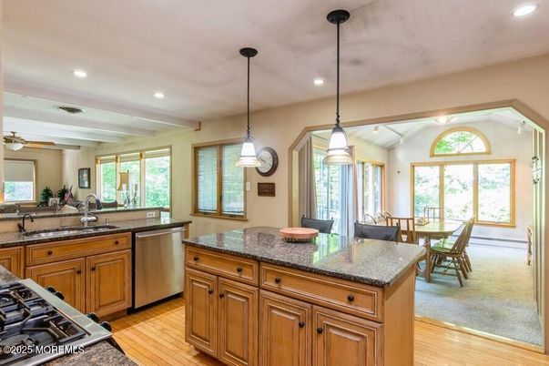 Dining room, Interior, Kitchen, Pendant Lights, Recessed Lighting, Stainless Steel Appliances, Wood Texture Flooring