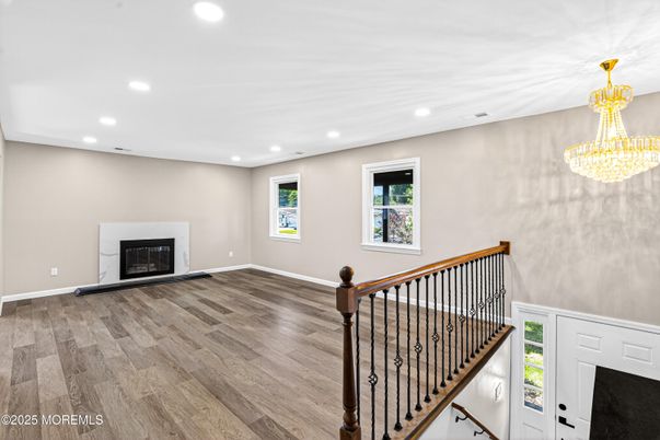 Chandelier, Empty room, Fireplace, Interior, Recessed Lighting, Wood Texture Flooring