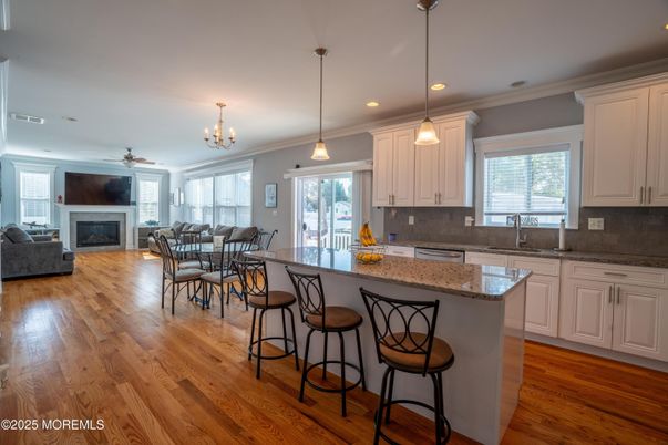 Dining room, Fireplace, Interior, Kitchen, Living room, Pendant Lights, Recessed Lighting, Wood Texture Flooring