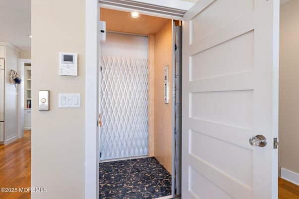 Elevator, Interior, Recessed Lighting, Wood Texture Flooring, Wooden Walls