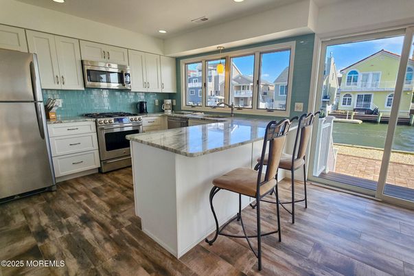 Interior, Kitchen, Recessed Lighting, Stainless Steel Appliances, Water, Wood Texture Flooring