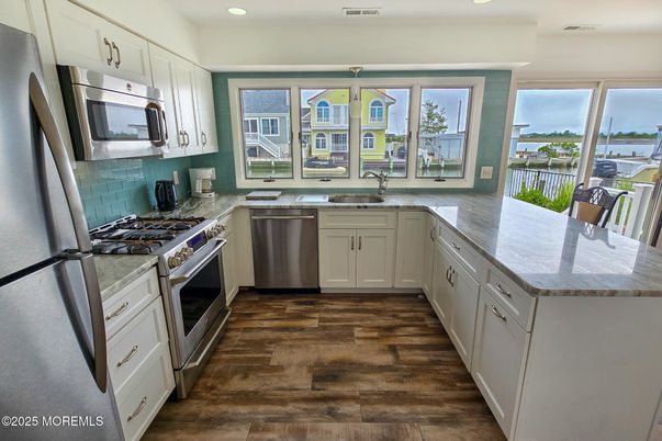 Interior, Kitchen, Recessed Lighting, Stainless Steel Appliances, Water, Wood Texture Flooring