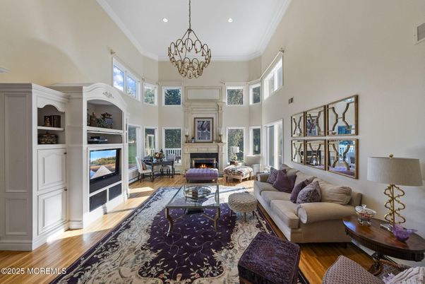 Chandelier, Fireplace, Interior, Living room, Recessed Lighting, Wood Texture Flooring