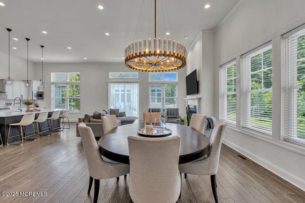 Chandelier, Dining room, Fireplace, Interior, Pendant Lights, Recessed Lighting, Wood Texture Flooring