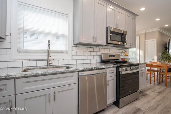 Dining room, Interior, Kitchen, Recessed Lighting, Stainless Steel Appliances, Wood Texture Flooring