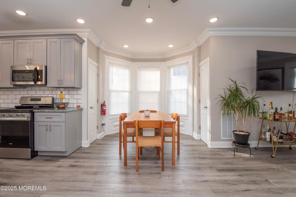 Dining room, Interior, Kitchen, Recessed Lighting, Stainless Steel Appliances, Wood Texture Flooring