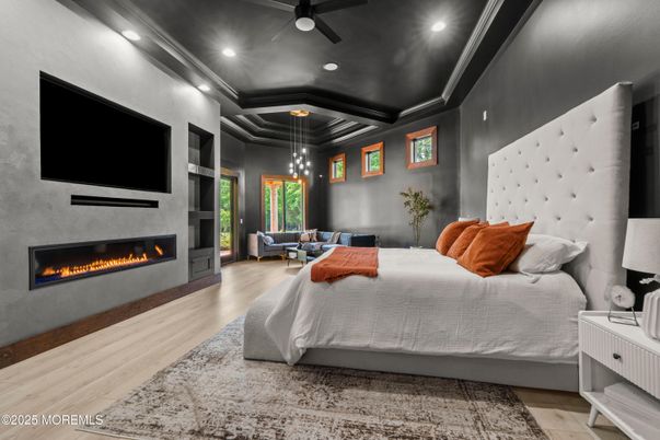 Bedroom, Fireplace, Interior, Pendant Lights, Recessed Lighting, Wood Texture Flooring