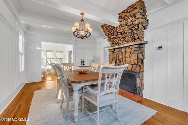 Chandelier, Dining room, Fireplace, Interior, Stone Walls, Wood Texture Flooring
