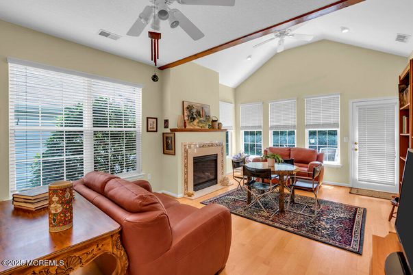 Dining room, Fireplace, Interior, Living room, Recessed Lighting, Wood Texture Flooring