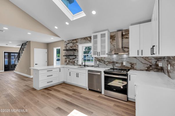Interior, Kitchen, Marble Walls, Recessed Lighting, Stainless Steel Appliances, Wood Texture Flooring