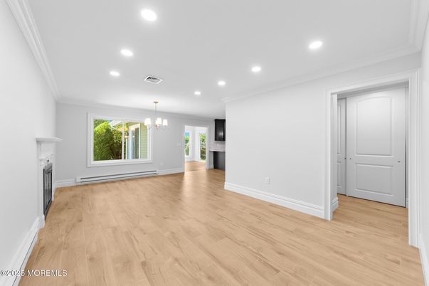 Chandelier, Empty room, Fireplace, Interior, Recessed Lighting, Wood Texture Flooring