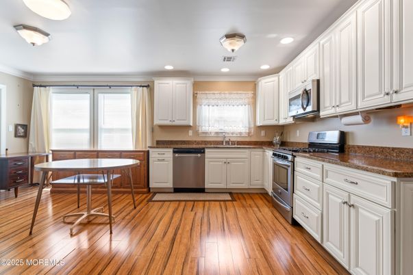 Dining room, Interior, Kitchen, Recessed Lighting, Stainless Steel Appliances, Wood Texture Flooring