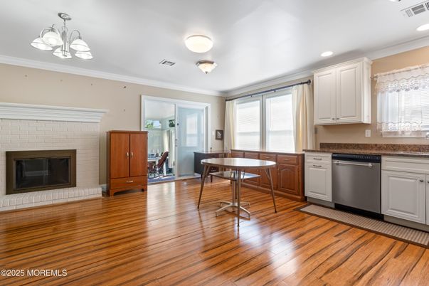 Chandelier, Dining room, Fireplace, Interior, Kitchen, Recessed Lighting, Wood Texture Flooring