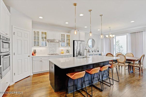 Dining room, Interior, Kitchen, Pendant Lights, Recessed Lighting, Stainless Steel Appliances, Wood Texture Flooring
