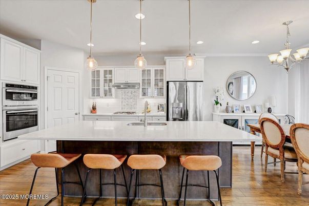 Chandelier, Interior, Kitchen, Pendant Lights, Recessed Lighting, Stainless Steel Appliances, Wood Texture Flooring