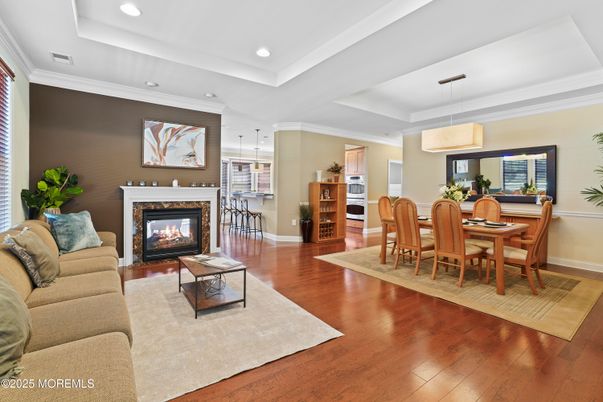 Dining room, Fireplace, Interior, Living room, Pendant Lights, Recessed Lighting, Wood Texture Flooring