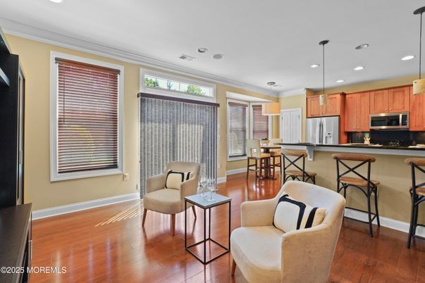 Dining room, Interior, Kitchen, Pendant Lights, Recessed Lighting, Stainless Steel Appliances, Wood Texture Flooring