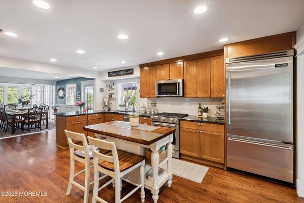 Dining room, Interior, Kitchen, Recessed Lighting, Stainless Steel Appliances, Wood Texture Flooring