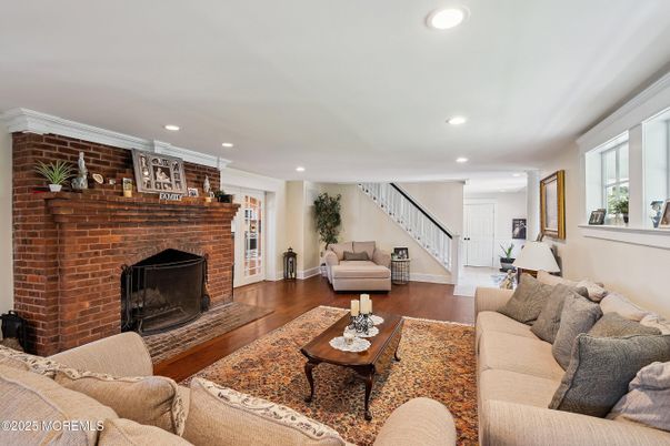 Fireplace, Interior, Living room, Recessed Lighting, Stone Walls, Wood Texture Flooring