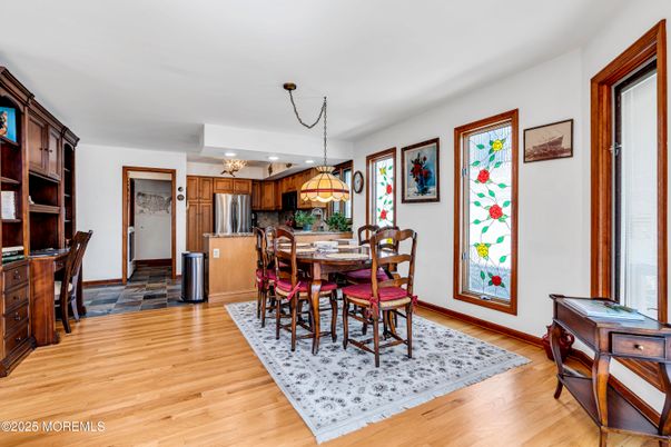 Chandelier, Dining room, Interior, Kitchen, Pendant Lights, Recessed Lighting, Stainless Steel Appliances, Wood Texture Flooring