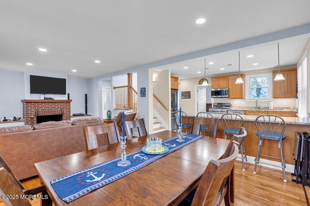 Dining room, Fireplace, Interior, Kitchen, Pendant Lights, Recessed Lighting, Wood Texture Flooring
