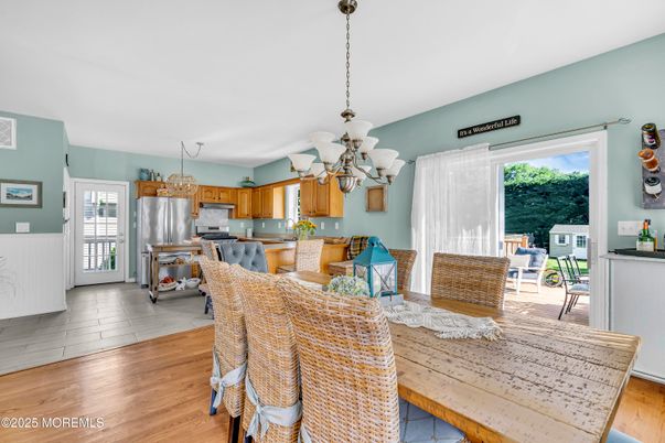Chandelier, Dining room, Interior, Kitchen, Stainless Steel Appliances, Wood Texture Flooring