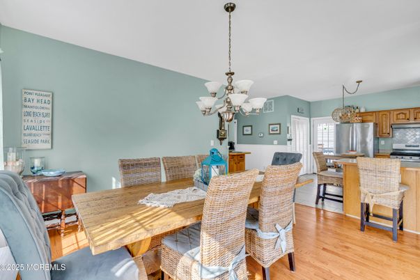 Chandelier, Dining room, Interior, Kitchen, Stainless Steel Appliances, Wood Texture Flooring