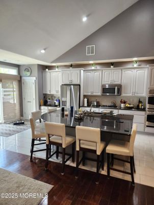 Dining room, Interior, Kitchen, Recessed Lighting, Stainless Steel Appliances, Wood Texture Flooring